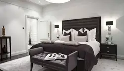 Dark bedroom interior with white wallpaper