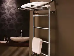 Electric heated towel rail in the bathroom photo