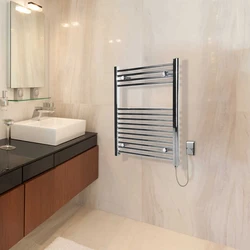 Electric Heated Towel Rail In The Bathroom Photo