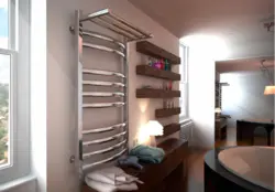 Electric heated towel rail in the bathroom photo