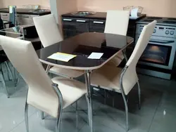 Black table and chairs in the kitchen photo