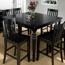 Black table and chairs in the kitchen photo