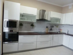 Kitchen in efficient apartments photo