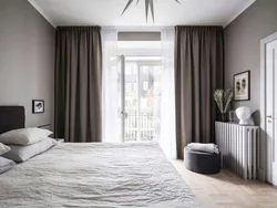 Gray curtains in the bedroom interior