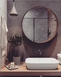 Bathroom with round mirror design