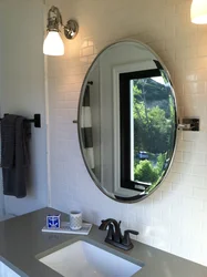 Bathroom with round mirror design