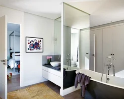 Bathroom With Wall-To-Wall Mirror Photo