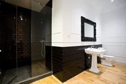 Bathroom design with dark floors and light walls
