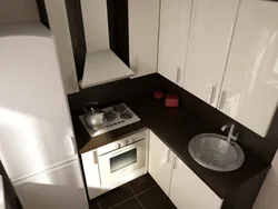 Interior Of A Small Corner Kitchen With A Refrigerator