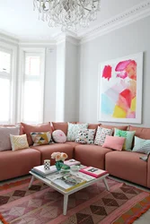 Living room design with pink sofa
