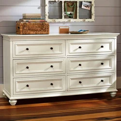 Chest of drawers in the bedroom made of wood photo