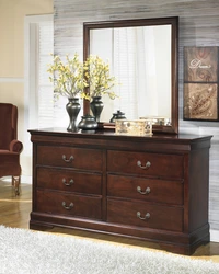 Chest Of Drawers In The Bedroom Made Of Wood Photo