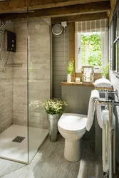 Bathtub in a wooden house with shower design