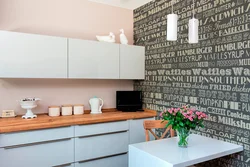 Adhesive wallpaper on the wall in the kitchen photo