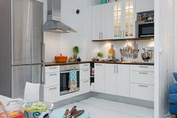 Silver refrigerator in the kitchen interior
