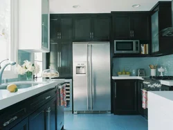 Silver refrigerator in the kitchen interior