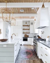 White kitchen in a wooden house in the interior