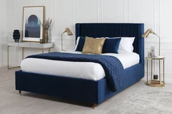 Blue bed in the bedroom photo