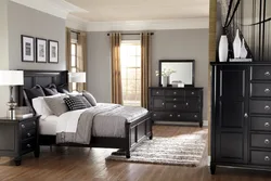 White bedroom with dark furniture photo