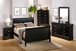 White bedroom with dark furniture photo