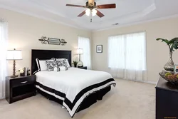 White bedroom with dark furniture photo