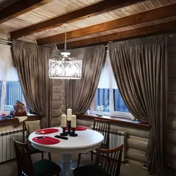 Curtains in the kitchen in a wooden house photo