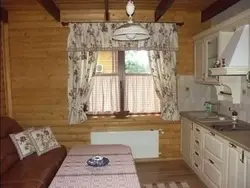 Curtains in the kitchen in a wooden house photo