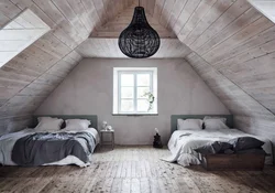 Attic design with a gable roof bedroom photo