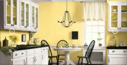 Yellow wallpaper in the kitchen in the interior photo