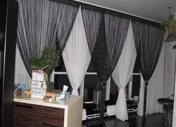 Black curtains in the kitchen interior