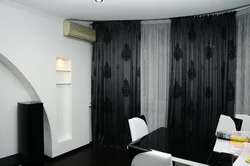 Black curtains in the kitchen interior