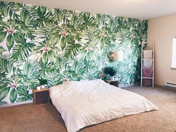 Wallpaper with leaves in the bedroom interior