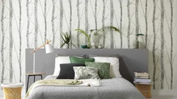 Wallpaper with leaves in the bedroom interior