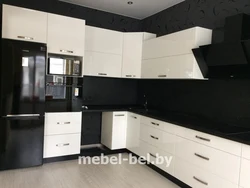 White kitchen with black handles and black countertop photo