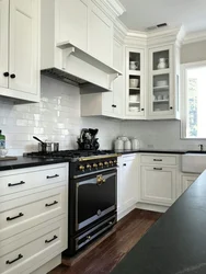 White kitchen with black handles and black countertop photo