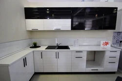 White kitchen with black handles and black countertop photo