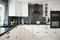 White kitchen with black handles and black countertop photo