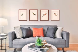 Posters in the living room interior above the sofa