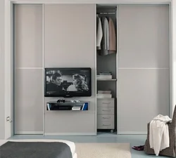 Wardrobe with TV in the bedroom photo