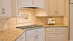 Kitchens with beige tile splashback photo