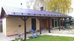 Garage with summer kitchen under one roof photo