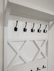 Do-it-yourself wall-mounted clothes hanger for the hallway photo