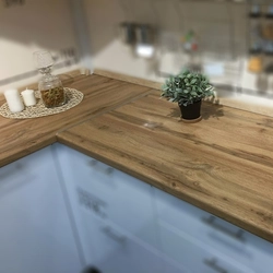 Oak ceramic countertop in the kitchen interior photo