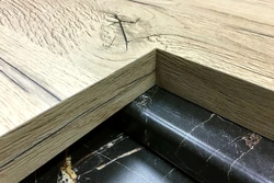 Oak ceramic countertop in the kitchen interior photo