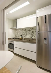 White kitchen with gray refrigerator photo