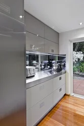 White kitchen with gray refrigerator photo