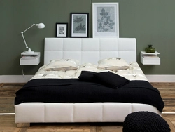 Nightstands near the bed in the bedroom photo