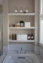 Shelves in the bathroom made of tiles in the wall photo