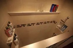 Shelves in the bathroom made of tiles in the wall photo