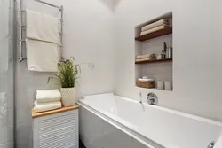 Shelves in the bathroom made of tiles in the wall photo